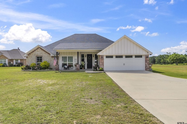 view of front of house with a garage and a front lawn