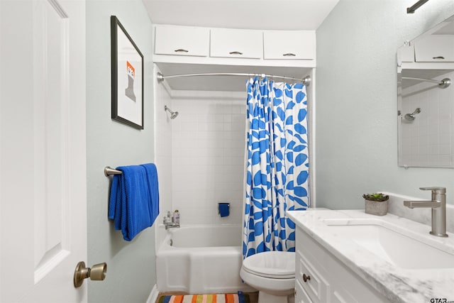 full bathroom with shower / bath combo, vanity, and toilet