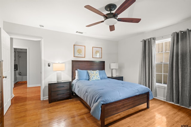 bedroom with ceiling fan and light hardwood / wood-style flooring