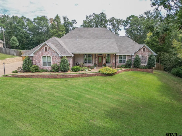 ranch-style home with a front lawn