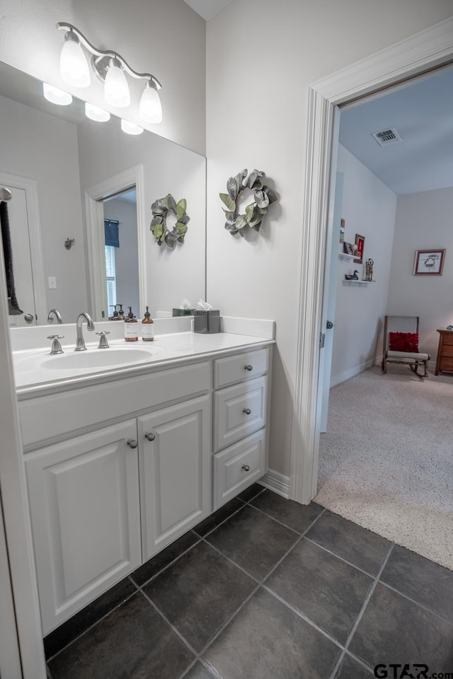 bathroom with vanity and tile patterned flooring