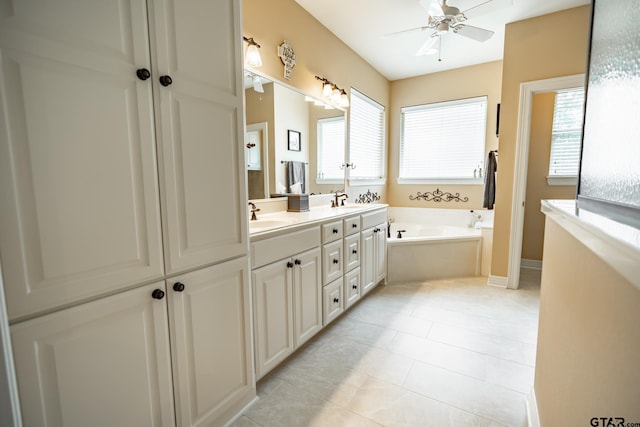 bathroom with vanity, a tub to relax in, tile patterned floors, and ceiling fan