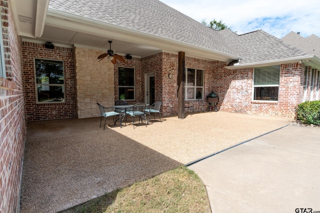 view of patio featuring ceiling fan