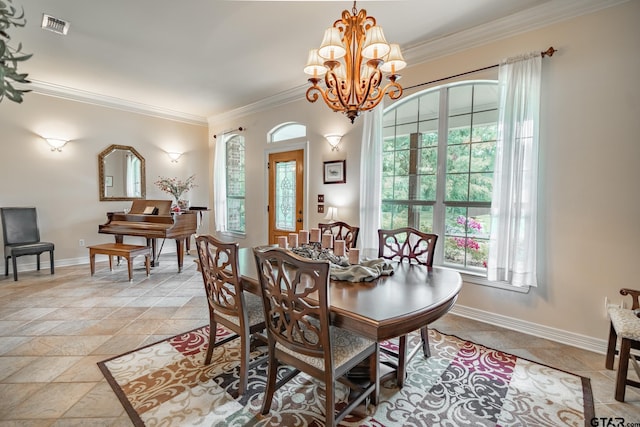 dining space with crown molding and an inviting chandelier