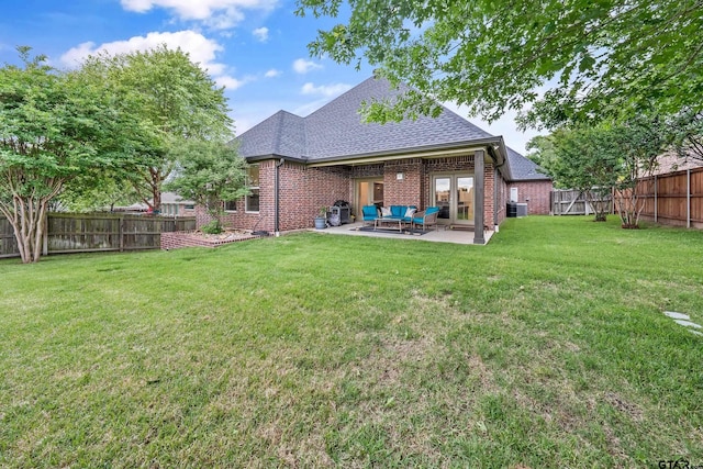 763 Hampton Hill Hill, Tyler, TX 75703 - back of property with a fenced backyard, a shingled roof, brick siding, and a patio