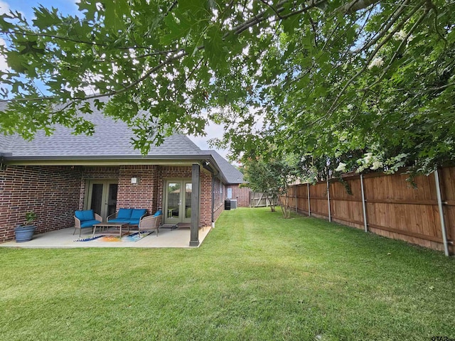 763 Hampton Hill Hill, Tyler, TX 75703 - fenced backyard featuring french doors, a patio area, and an outdoor hangout area