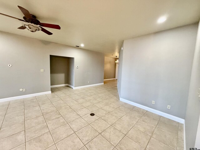 spare room with recessed lighting, baseboards, and ceiling fan