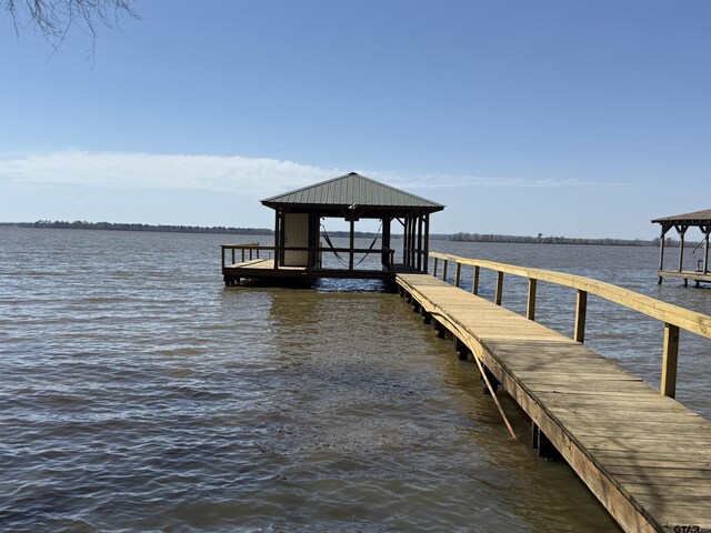 dock area featuring a water view