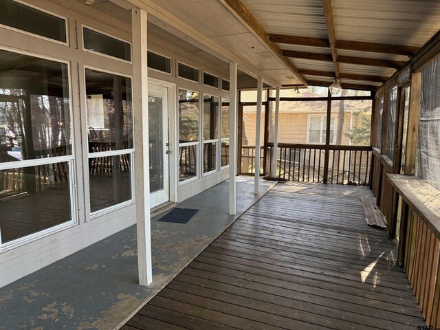 unfurnished sunroom with plenty of natural light