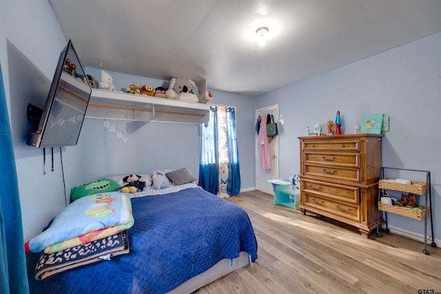 bedroom with wood-type flooring