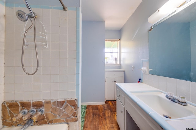 bathroom with vanity and hardwood / wood-style flooring