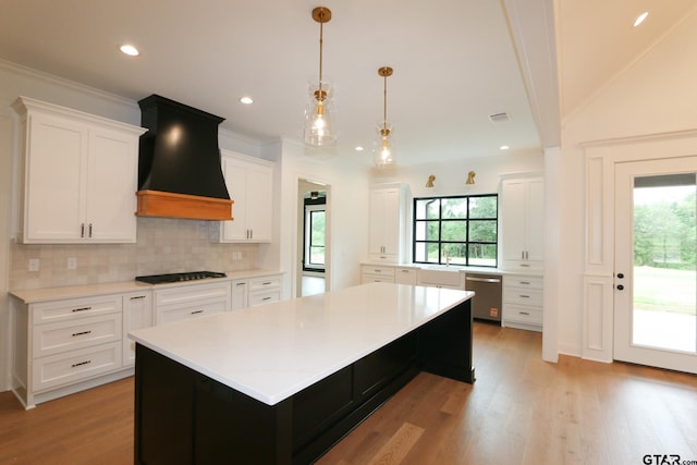16511 Cooper Way, Tyler, TX 75703 - kitchen with dishwasher, black stovetop, decorative backsplash, custom range hood, and white cabinetry