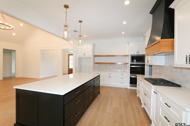 16511 Cooper Way, Tyler, TX 75703 - kitchen featuring stainless steel appliances, custom range hood, dark cabinetry, white cabinets, and crown molding