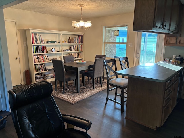 114 Briar Ln, Crockett, TX 75835 - dining room featuring a textured ceiling, dark wood-style flooring, and a chandelier
