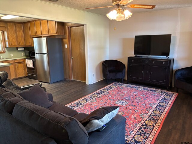 114 Briar Ln, Crockett, TX 75835 - entryway featuring plenty of natural light, a textured ceiling, dark wood-style floors, ceiling fan, and baseboards