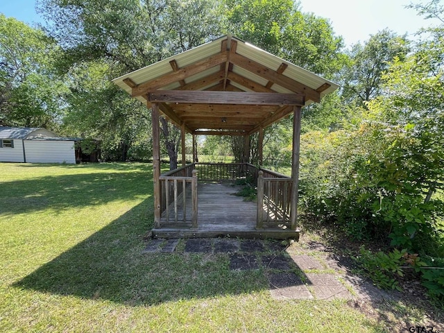 114 Briar Ln, Crockett, TX 75835 - view of property's community featuring a lawn, a deck, and an outdoor structure