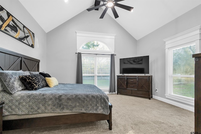 carpeted bedroom with ceiling fan, lofted ceiling, and multiple windows