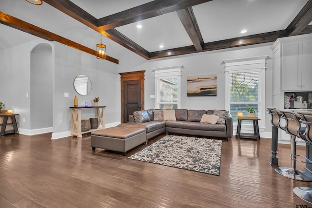 living room featuring beamed ceiling, coffered ceiling, and dark hardwood / wood-style flooring