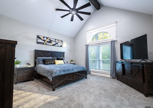 carpeted bedroom featuring beam ceiling, high vaulted ceiling, and ceiling fan