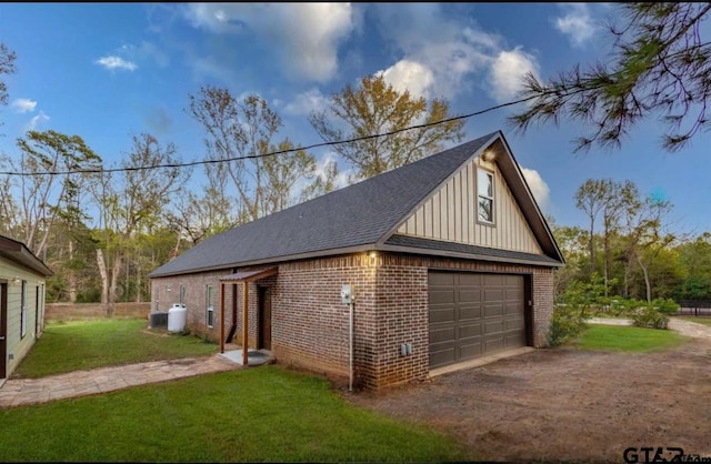 garage featuring a lawn