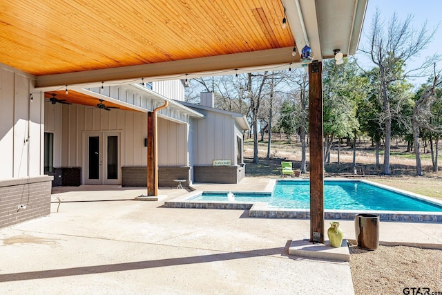 outdoor pool featuring french doors, a patio, and ceiling fan