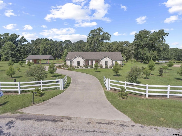 view of front of property featuring a rural view and a front lawn