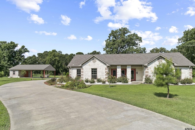 view of front of house with a front lawn and a carport