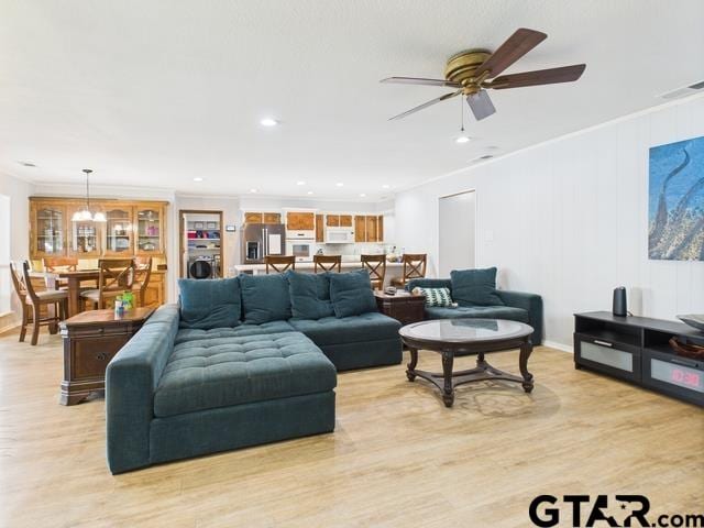 14227 Melody Ln, Malakoff, TX 75148 - living area with light wood-style floors, a ceiling fan, ornamental molding, and recessed lighting