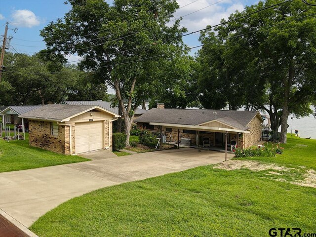 14227 Melody Ln, Malakoff, TX 75148 - view of front of property with concrete driveway, a front yard, brick siding, and a garage