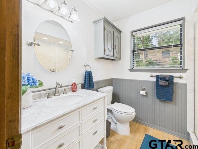 14227 Melody Ln, Malakoff, TX 75148 - full bath featuring wainscoting, vanity, wood finished floors, and toilet