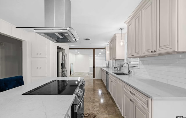 109 Maxine St, Mineola, TX 75773 - kitchen with a sink, appliances with stainless steel finishes, decorative backsplash, light stone counters, and hanging light fixtures