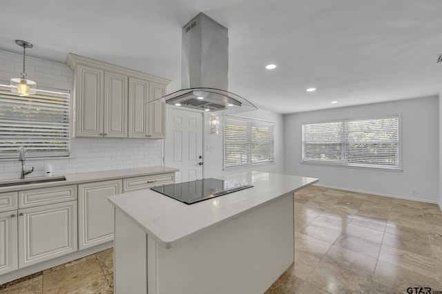 109 Maxine St, Mineola, TX 75773 - kitchen featuring island exhaust hood, a sink, black electric stovetop, cream cabinetry, and stone tile floors