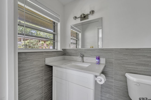109 Maxine St, Mineola, TX 75773 - half bath featuring tile walls, toilet, and vanity