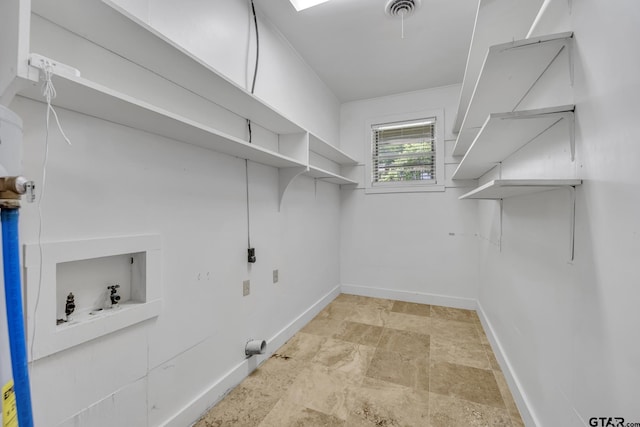 109 Maxine St, Mineola, TX 75773 - laundry room with stone finish floors, washer hookup, and baseboards
