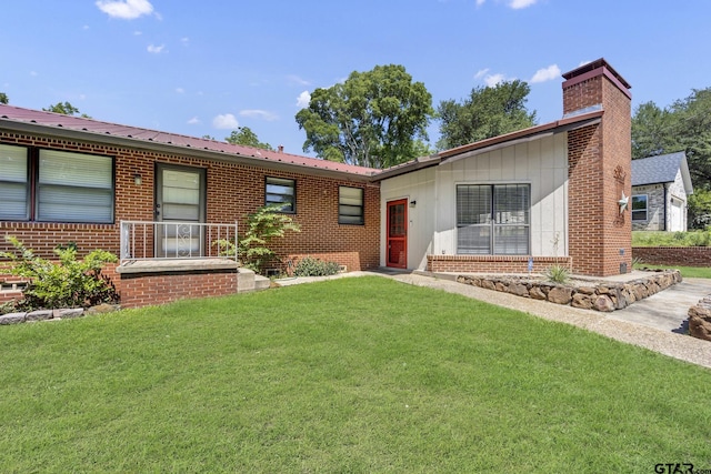 109 Maxine St, Mineola, TX 75773 - single story home with a front yard, brick siding, and a chimney