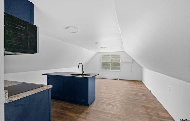 109 Maxine St, Mineola, TX 75773 - kitchen with blue cabinetry, black electric stovetop, a sink, dark wood-type flooring, and vaulted ceiling