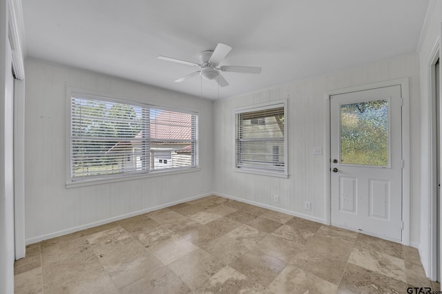109 Maxine St, Mineola, TX 75773 - foyer with a ceiling fan, baseboards, and light stone finish flooring