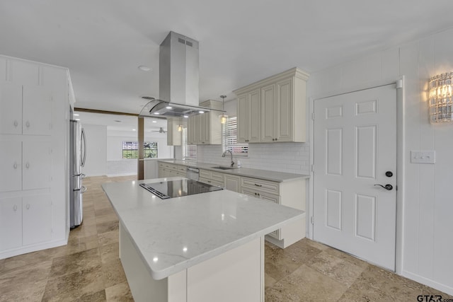 109 Maxine St, Mineola, TX 75773 - kitchen with island exhaust hood, stainless steel appliances, a kitchen island, light stone finish floors, and decorative backsplash