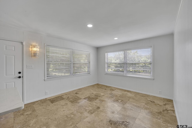 109 Maxine St, Mineola, TX 75773 - empty room with baseboards, stone finish floors, and recessed lighting