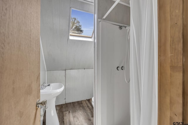 109 Maxine St, Mineola, TX 75773 - bathroom featuring a shower with curtain and wood finished floors