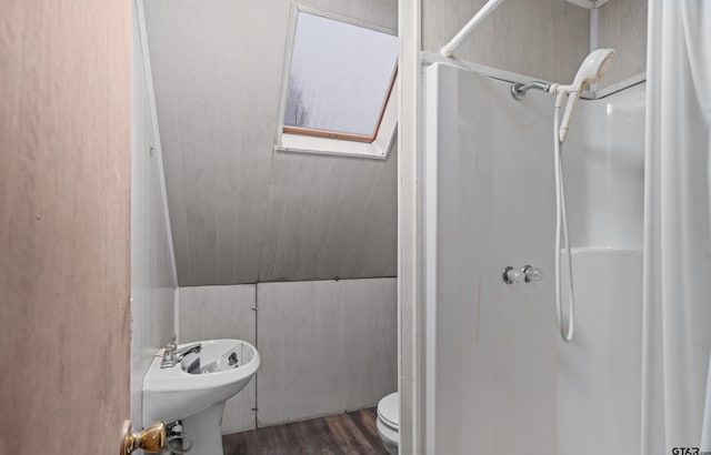 109 Maxine St, Mineola, TX 75773 - bathroom featuring a stall shower, toilet, and wood finished floors