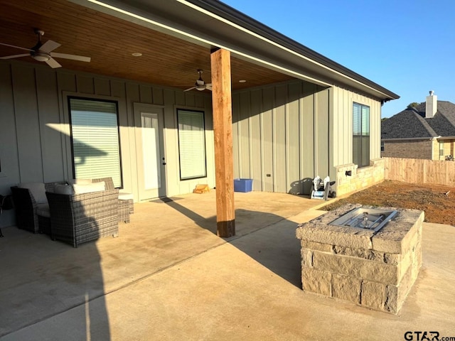 view of patio / terrace featuring ceiling fan and an outdoor fire pit