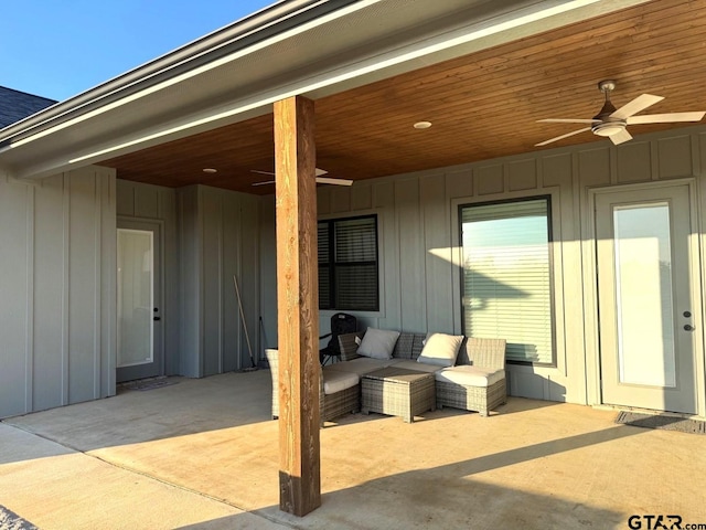 view of patio with an outdoor living space and ceiling fan