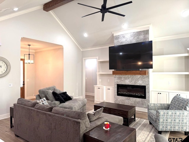 16310 Rainier, Lindale, TX 75771 - living room featuring wood finished floors, a ceiling fan, a glass covered fireplace, baseboards, and ornamental molding