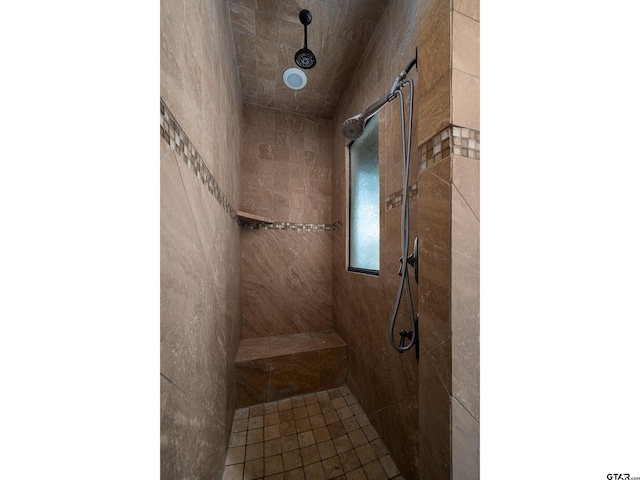 bathroom featuring tiled shower