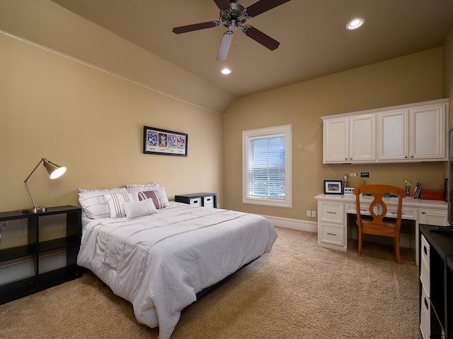 carpeted bedroom featuring built in desk, ceiling fan, and lofted ceiling