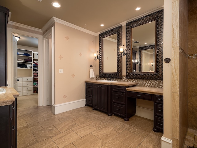 bathroom featuring ornamental molding, decorative backsplash, and vanity