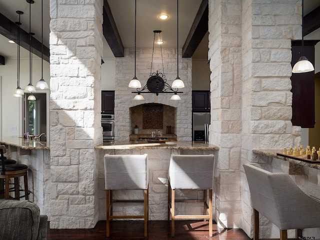 kitchen with kitchen peninsula, a kitchen breakfast bar, light stone countertops, stainless steel refrigerator with ice dispenser, and dark hardwood / wood-style flooring