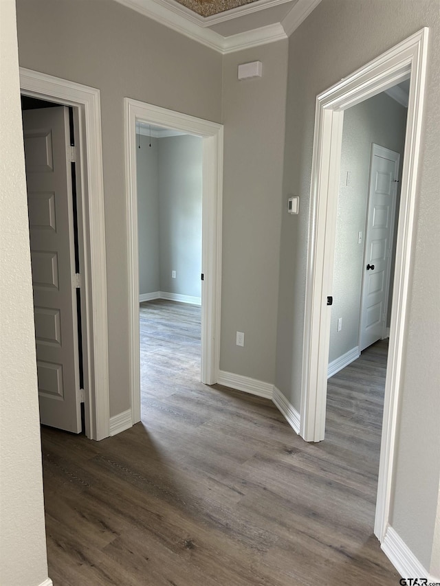 300RODENAVENU 300 Roden Ave, Gladewater, TX 75647 - hallway with ornamental molding, dark wood-style floors, and baseboards