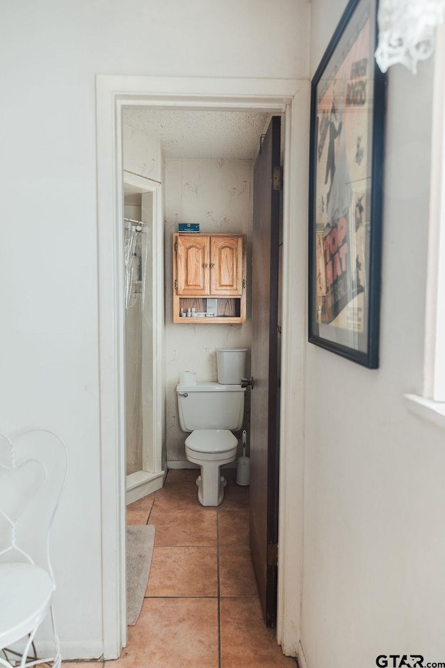 8105 Jewell Ln, Tyler, TX 75703 - bathroom with toilet and tile patterned floors
